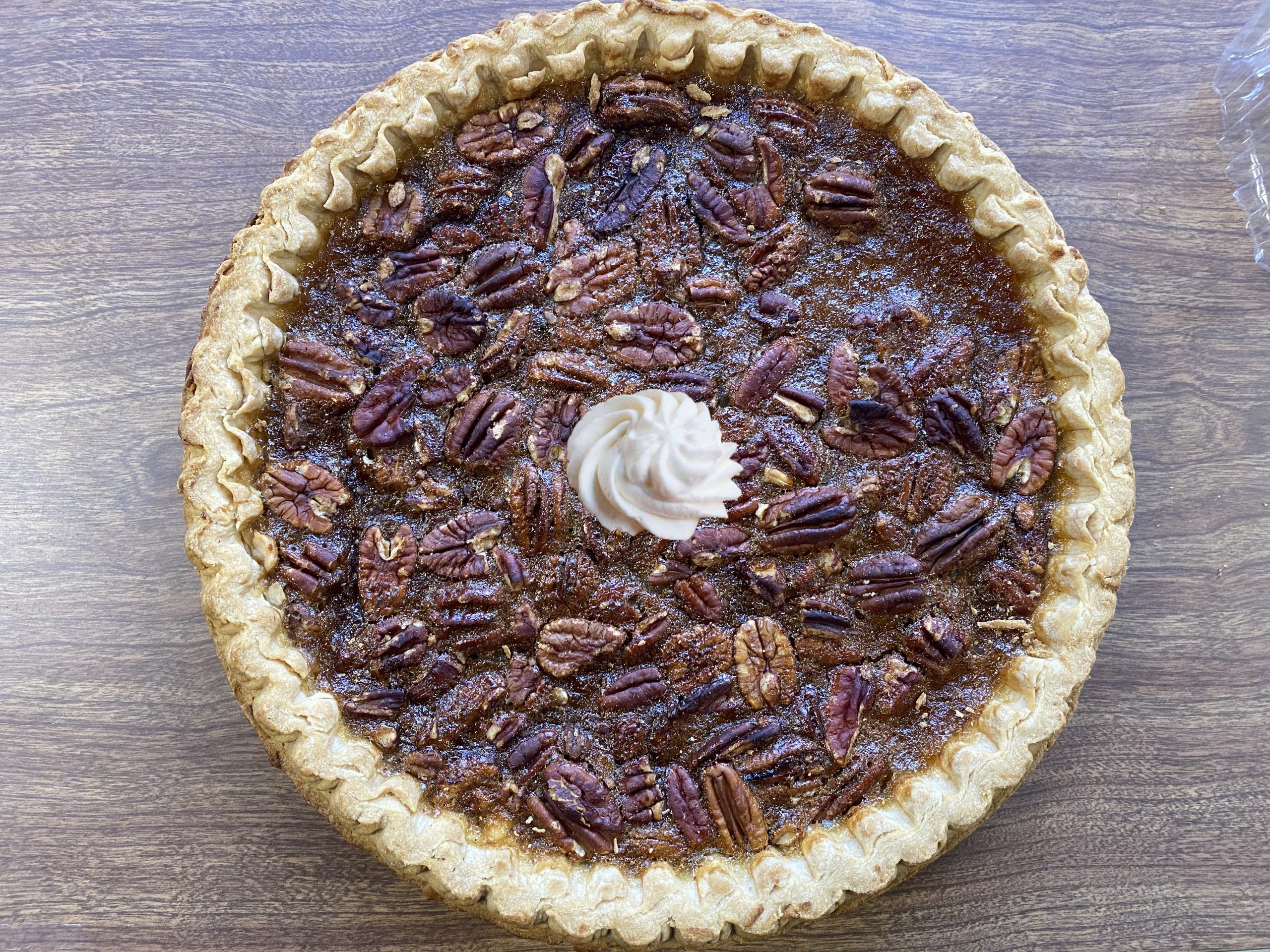 Pecan pie with whipped cream in the middle